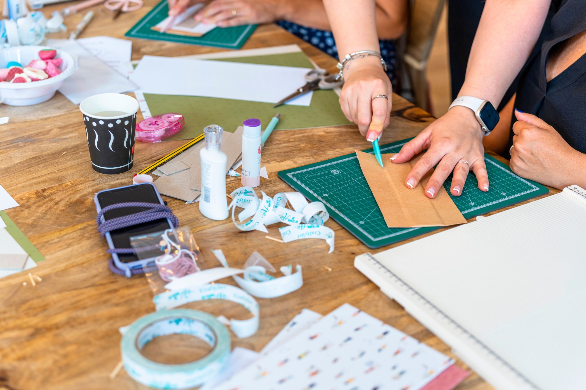 Scrapbook workshop. Colleagues helping each other. Companionship concept